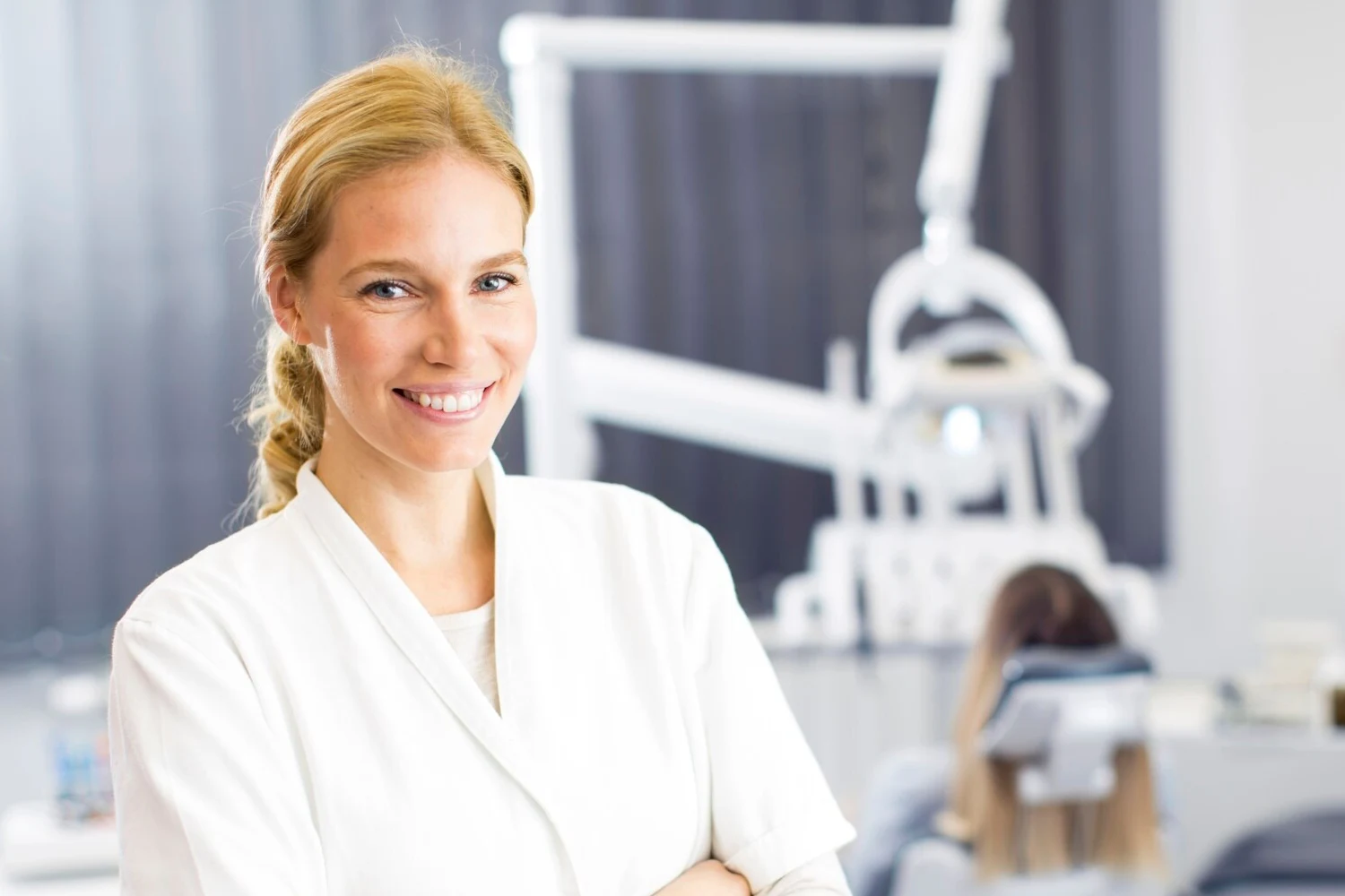 woman smiling in clinic, dental clinic owner