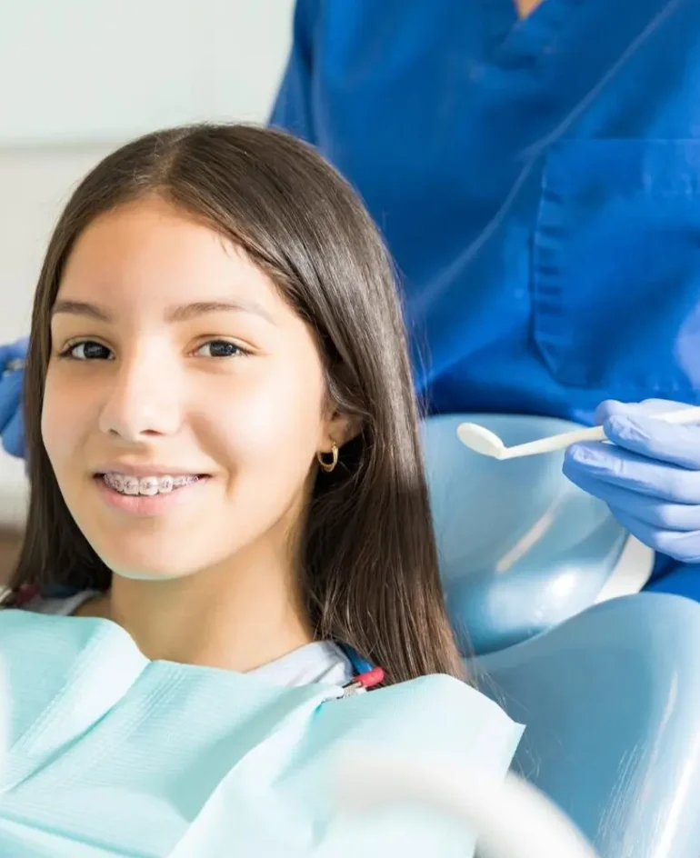 Orthodontist and a teenage girl patient