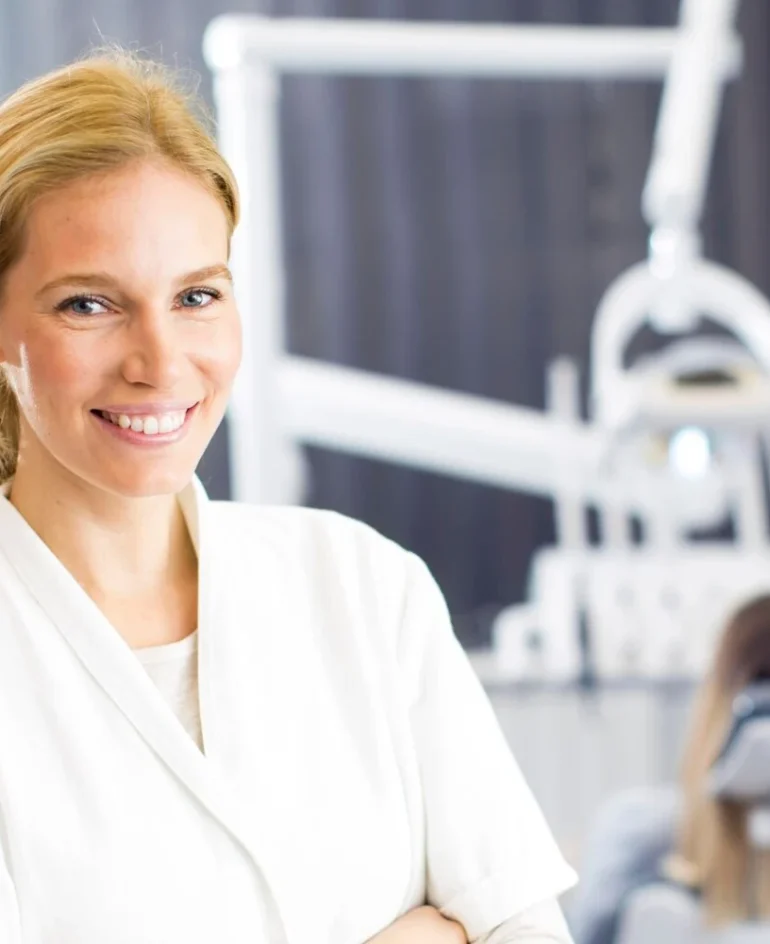 woman smiling in clinic, dental clinic owner